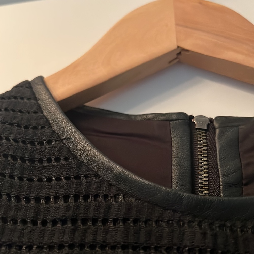 Helmut lane.  Size 4 black, chaneal material with leap trimming. Great condition